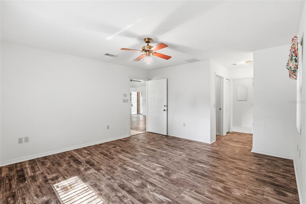 534 Southwest Thorne Lane Fort White, FL 32038 - Photo 30 of 51 a view of a room with wooden floor and ceiling fan