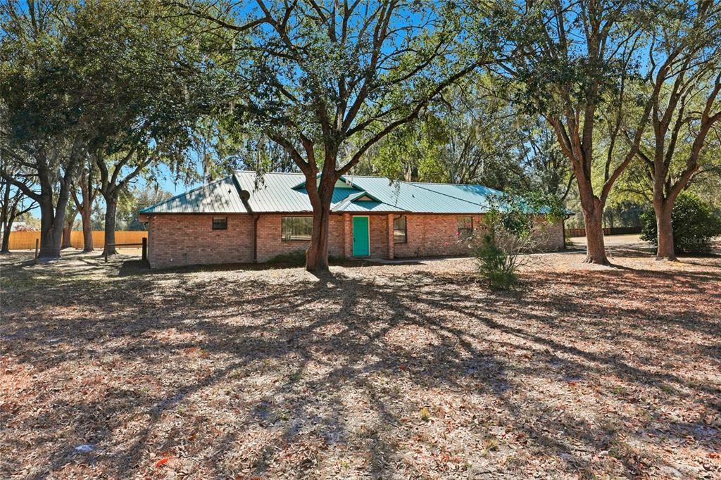 534 Southwest Thorne Lane Fort White, FL 32038 - Photo 3 of 51 a view of a backyard with large trees
