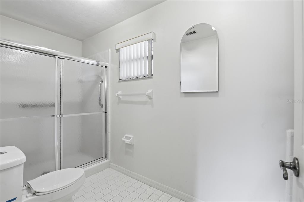 534 Southwest Thorne Lane Fort White, FL 32038 - Photo 34 of 51 a bathroom with a toilet and a shower