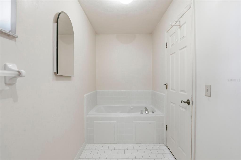 534 Southwest Thorne Lane Fort White, FL 32038 - Photo 35 of 51 a white bath tub sitting next to a white sink and vanity