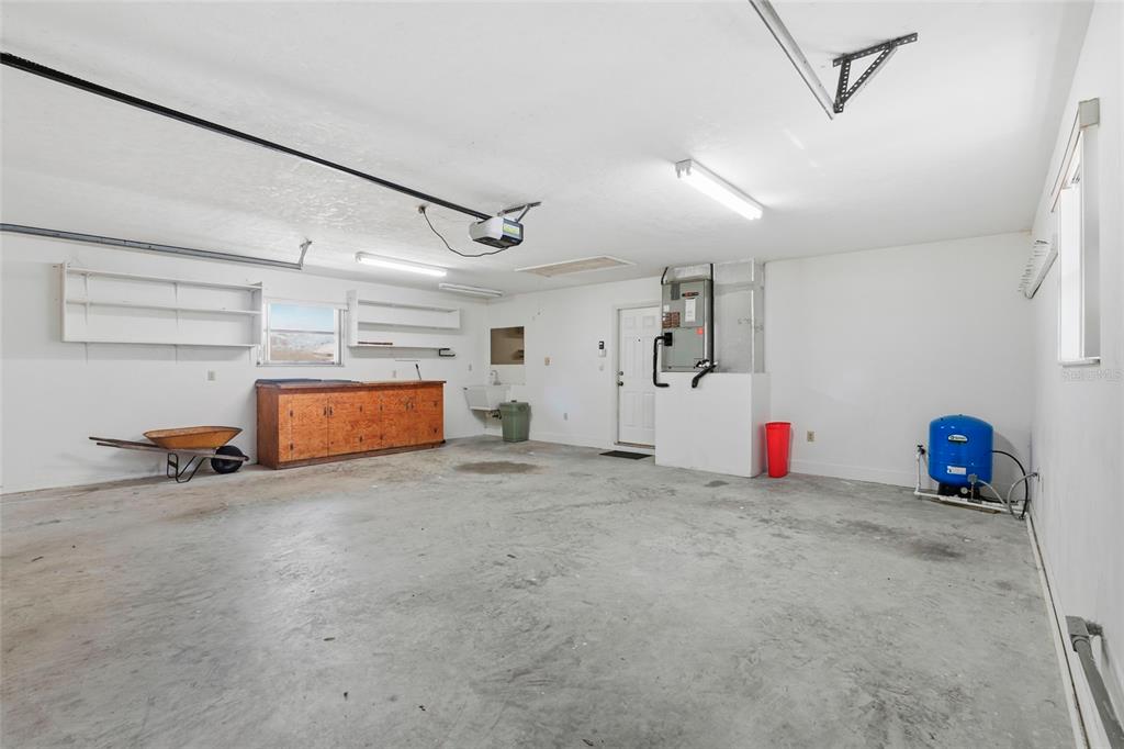 534 Southwest Thorne Lane Fort White, FL 32038 - Photo 37 of 51 a view of a room with gym equipment and a chandelier