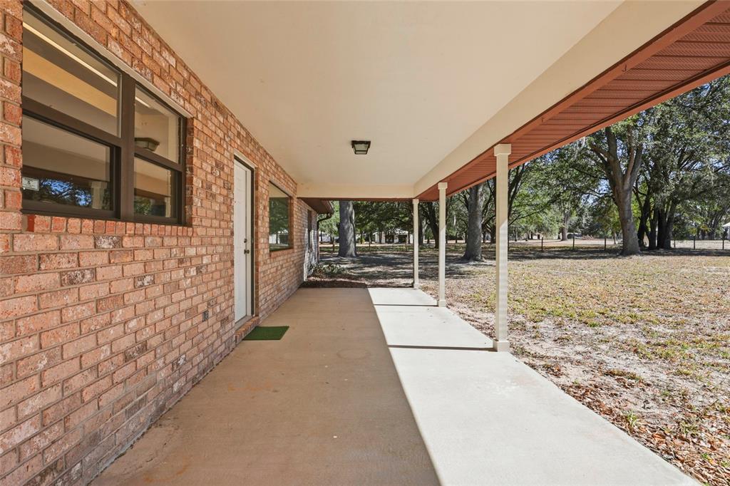 534 Southwest Thorne Lane Fort White, FL 32038 - Photo 39 of 51 a view of a pathway along a building