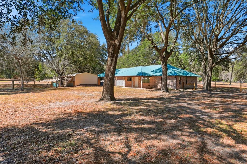 534 Southwest Thorne Lane Fort White, FL 32038 - Photo 46 of 51 a view of a yard with a tree