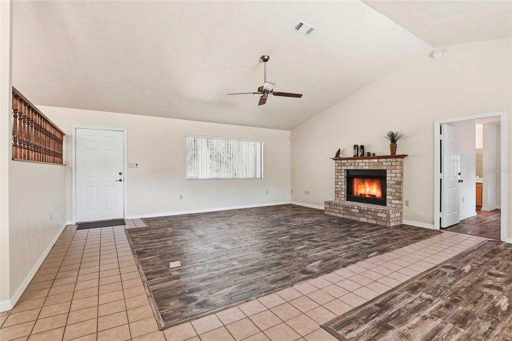 534 Southwest Thorne Lane Fort White, FL 32038 - Photo 9 of 51 a view of an empty room with a fireplace and a window