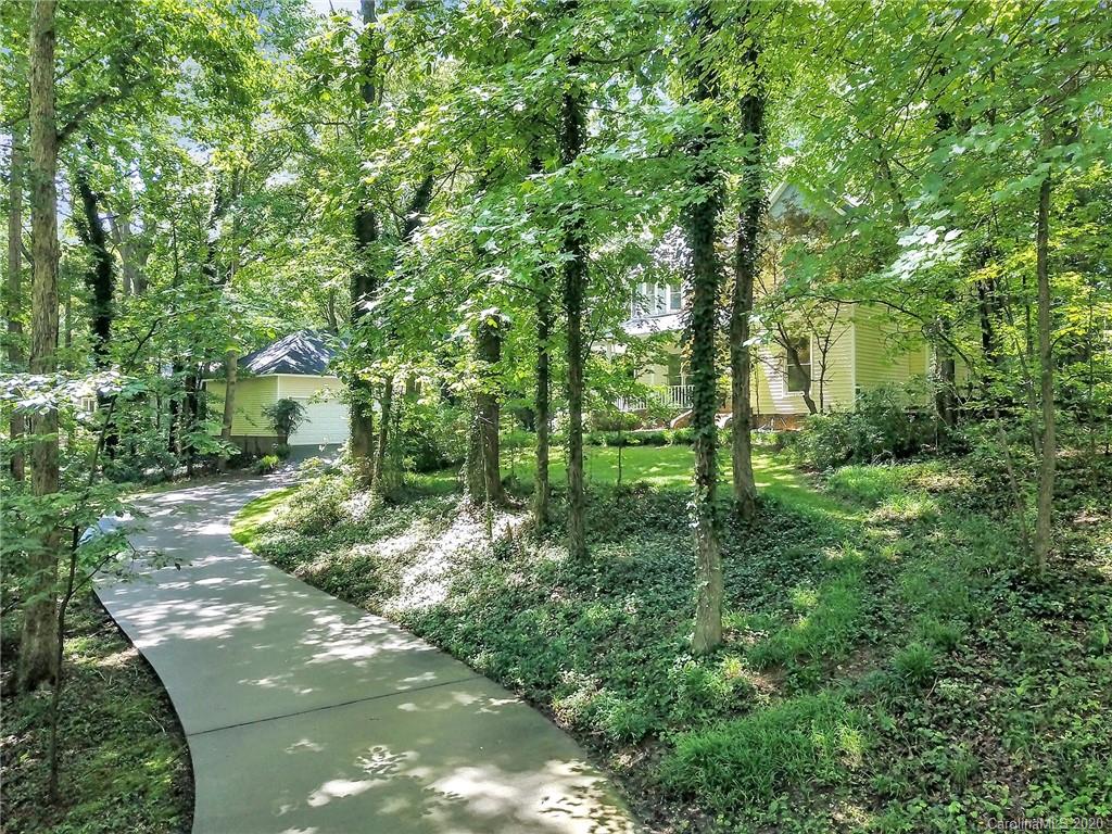 2685 Farmstead Lane, Unit 2685 Fort Mill, SC 29708 - Photo 2 of 30 a backyard of a house with lots of green space