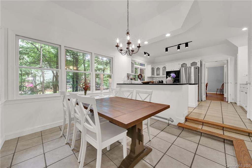 2685 Farmstead Lane, Unit 2685 Fort Mill, SC 29708 - Photo 15 of 30 a view of a dining room with furniture window and outside view