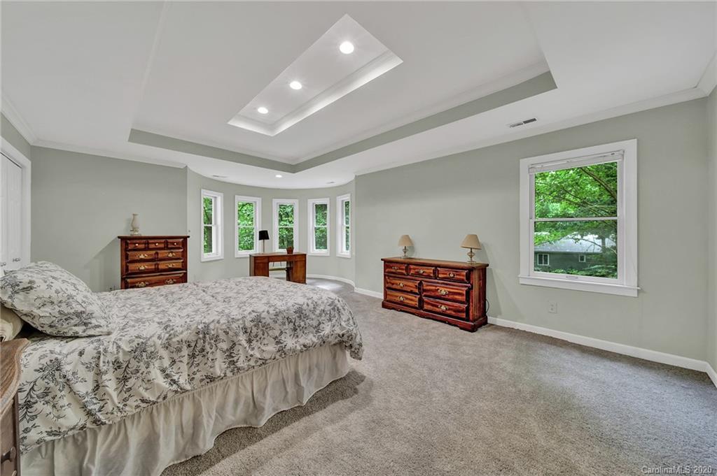 2685 Farmstead Lane, Unit 2685 Fort Mill, SC 29708 - Photo 21 of 30 a bedroom with furniture and a flat screen tv