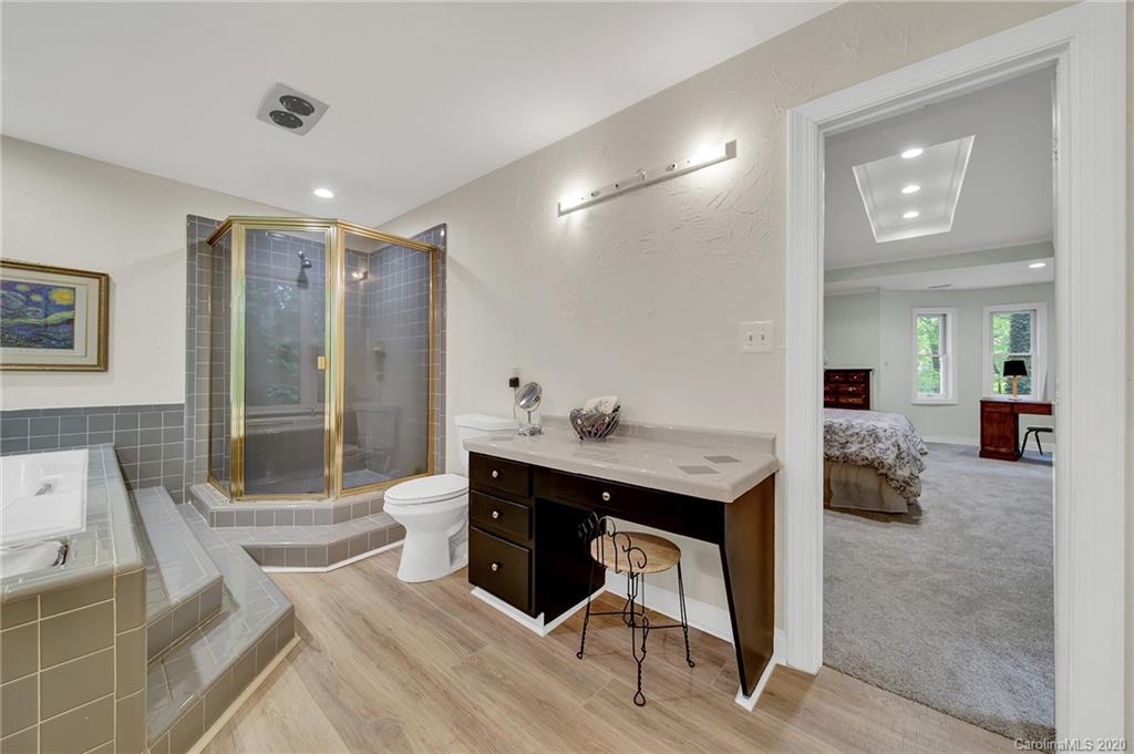 2685 Farmstead Lane, Unit 2685 Fort Mill, SC 29708 - Photo 24 of 30 a spacious bathroom with a shower sink and mirror