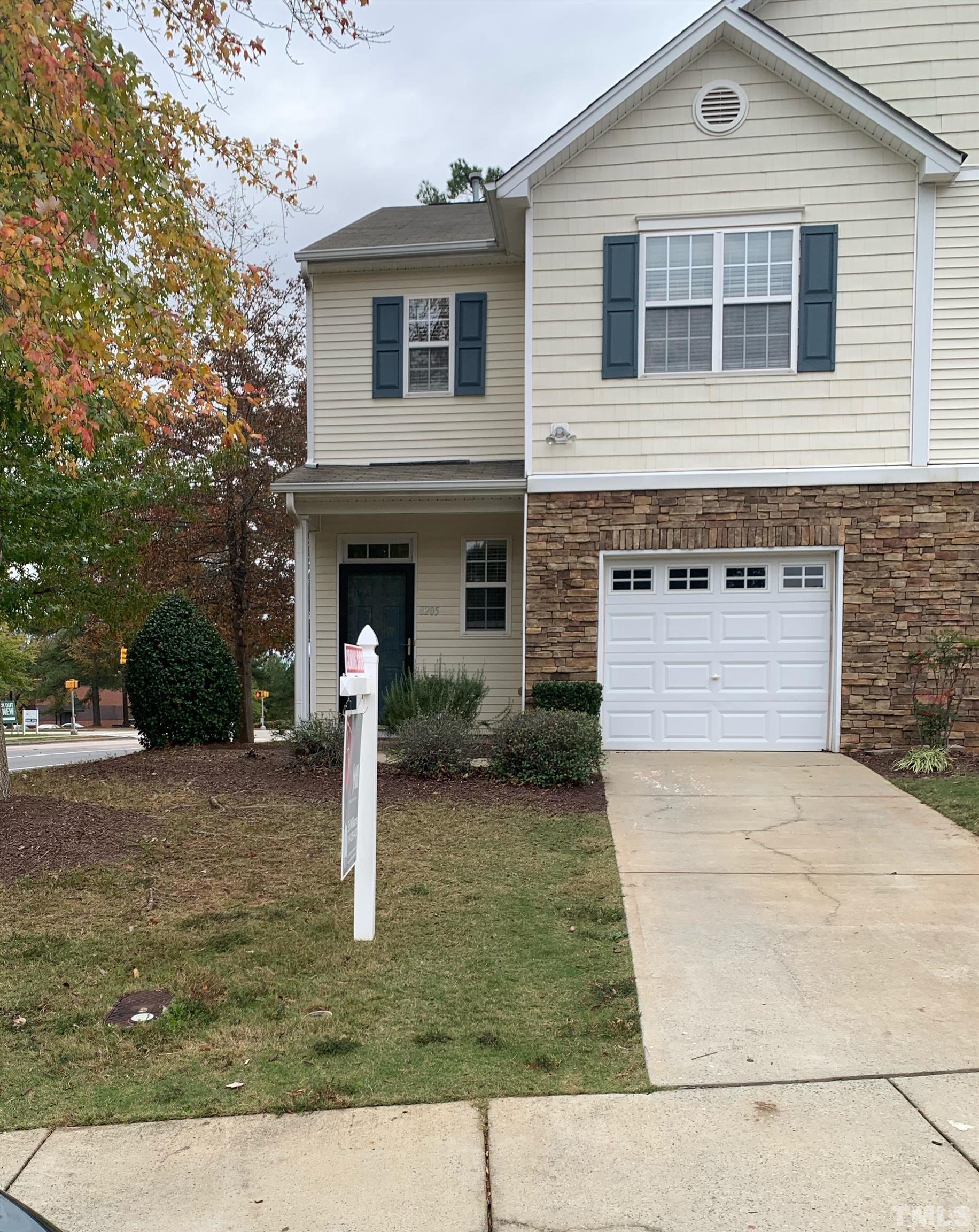 8205 Martello Lane Raleigh, NC 27613 - Photo 1 of 28 a front view of a house with garden