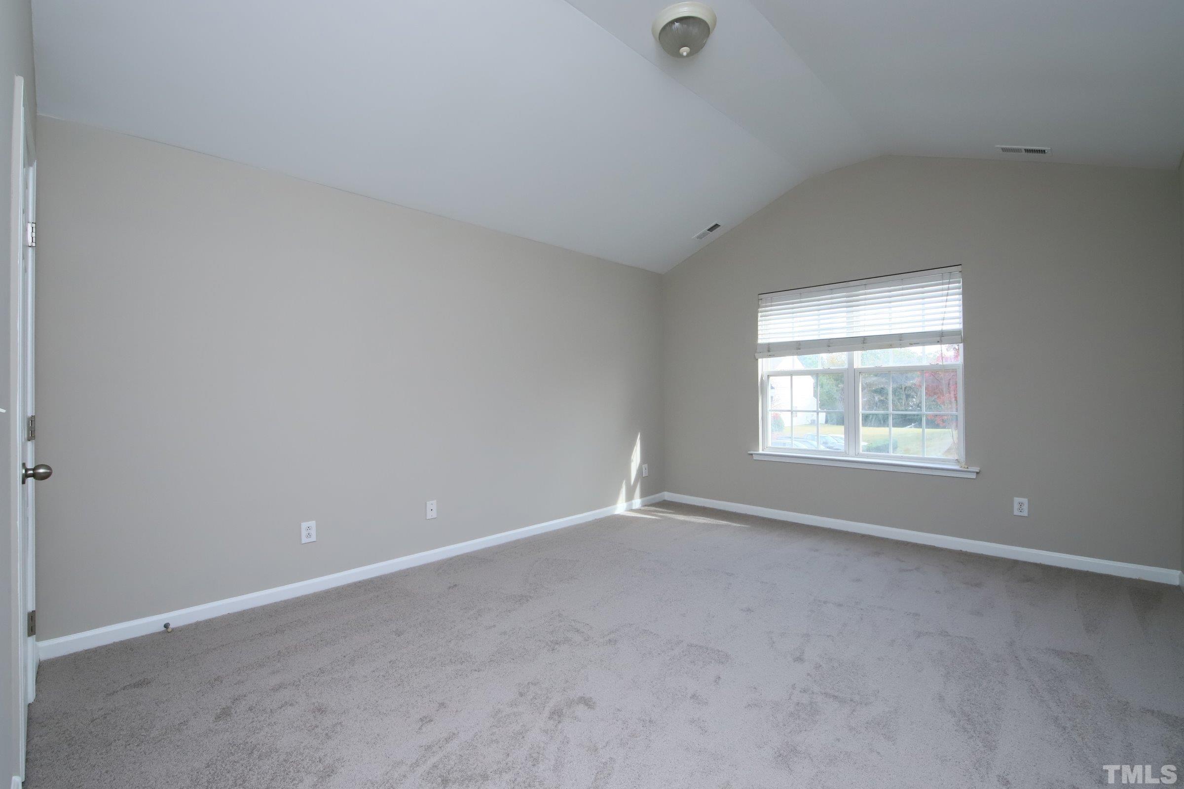 8205 Martello Lane Raleigh, NC 27613 - Photo 15 of 28 an empty room with a window