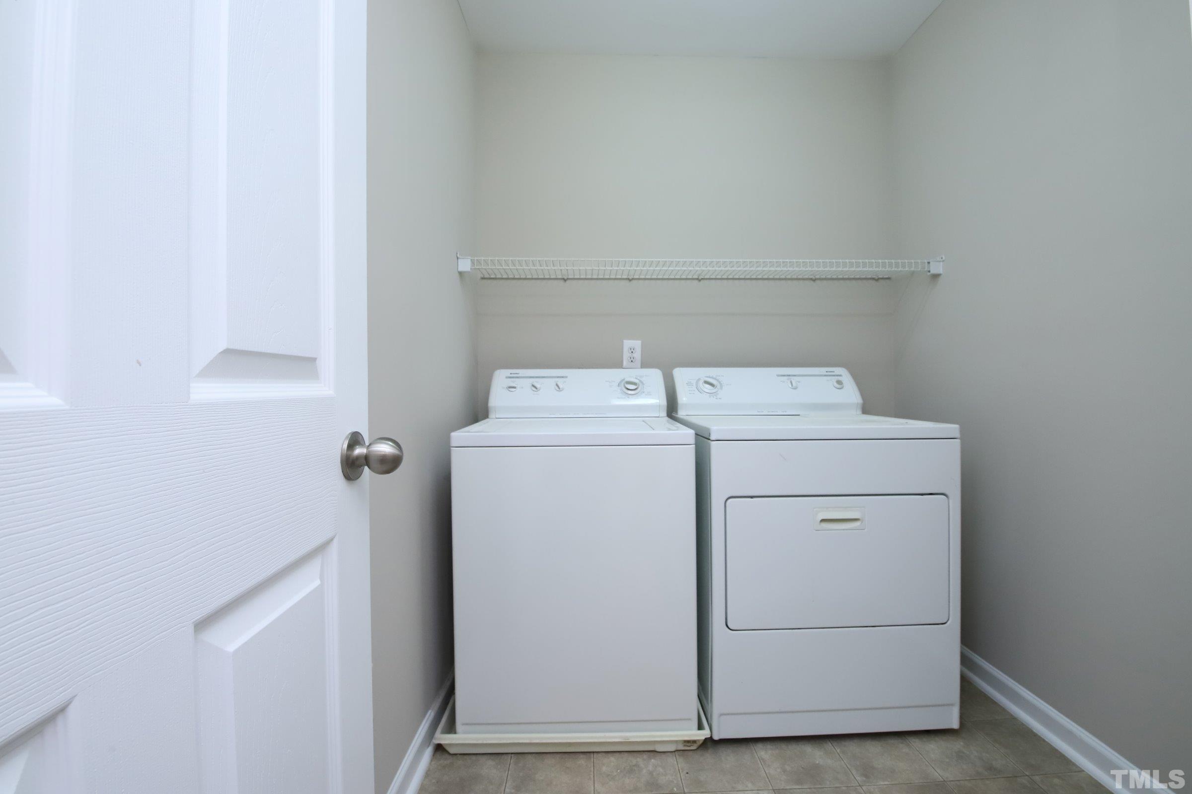 8205 Martello Lane Raleigh, NC 27613 - Photo 18 of 28 a utility room with dryer and washer