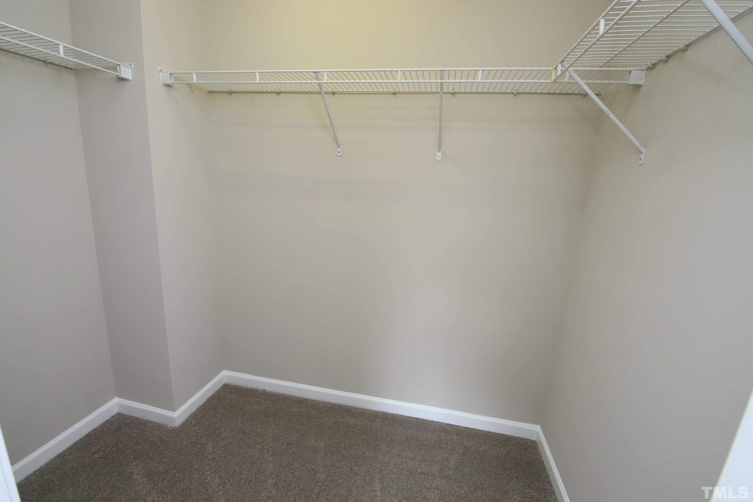 8205 Martello Lane Raleigh, NC 27613 - Photo 24 of 28 a view of an empty walk in closet