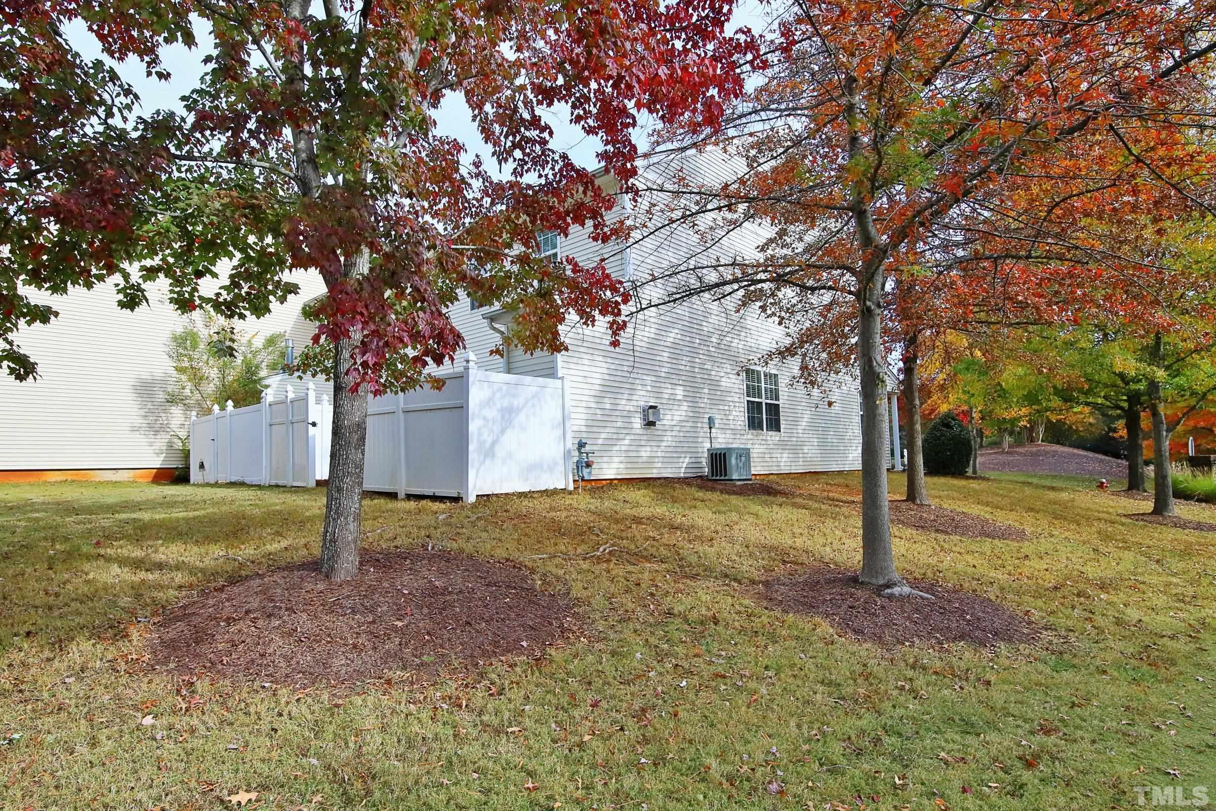 8205 Martello Lane Raleigh, NC 27613 - Photo 28 of 28 a view of a yard with a tree