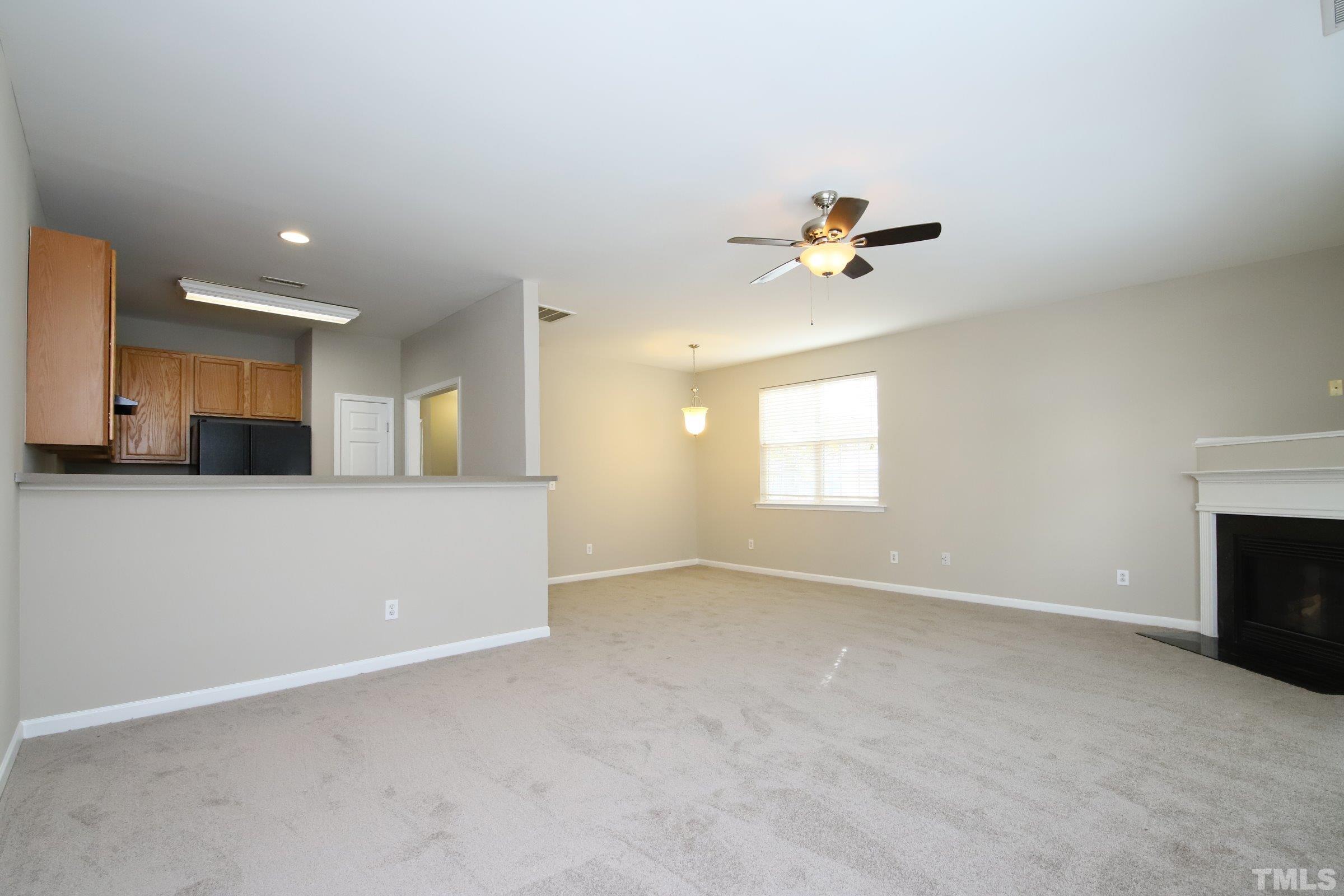 8205 Martello Lane Raleigh, NC 27613 - Photo 9 of 28 wooden floor in an empty room with a window