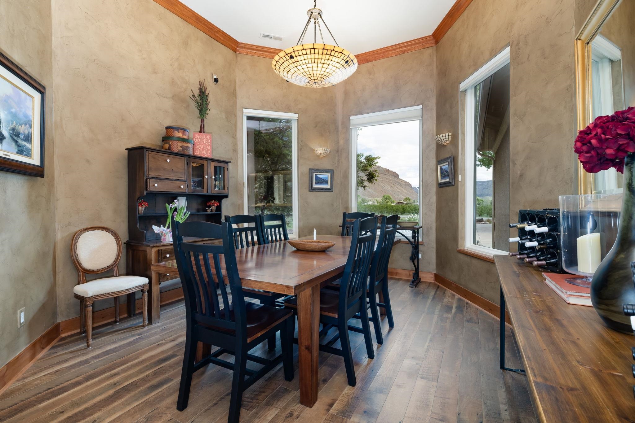 759-36 36 3/10 Road Palisade, CO 81526 - Photo 8 of 39 a view of a dining room with furniture window and wooden floor