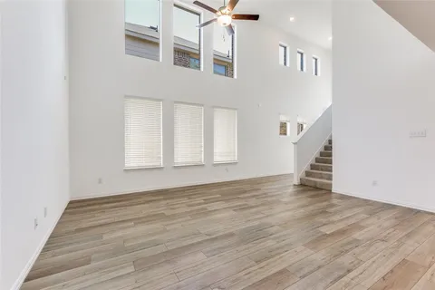 a view of an entryway with wooden floor
