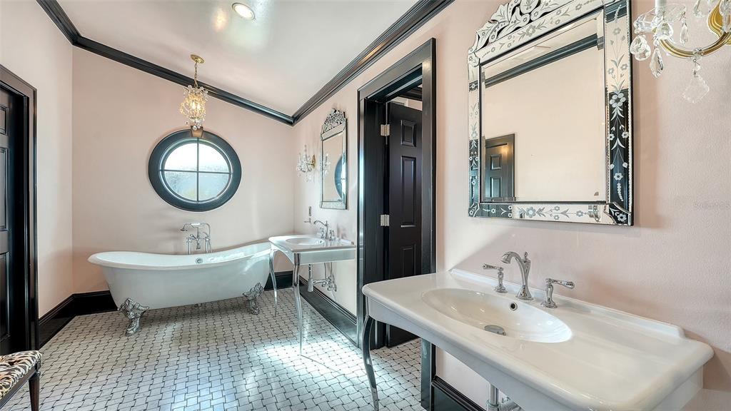 513 Villa Rosa Way Anna Maria, FL 34216 - Photo 16 of 57 a bathroom with a toilet sink and mirror