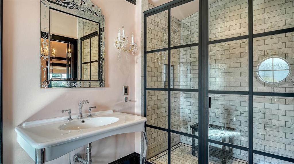 513 Villa Rosa Way Anna Maria, FL 34216 - Photo 17 of 57 a bathroom with a sink and a mirror