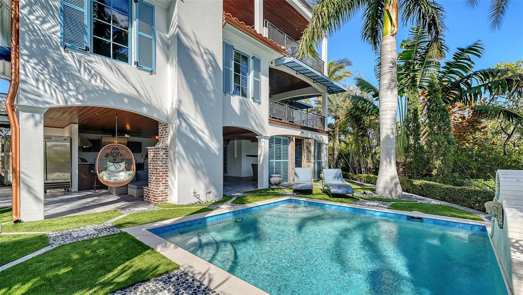 513 Villa Rosa Way Anna Maria, FL 34216 - Photo 29 of 57 a view of a house with pool yard and sitting area