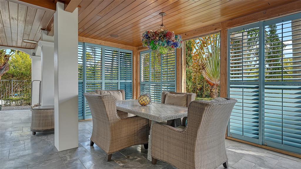 513 Villa Rosa Way Anna Maria, FL 34216 - Photo 30 of 57 a view of a dining room with furniture and window
