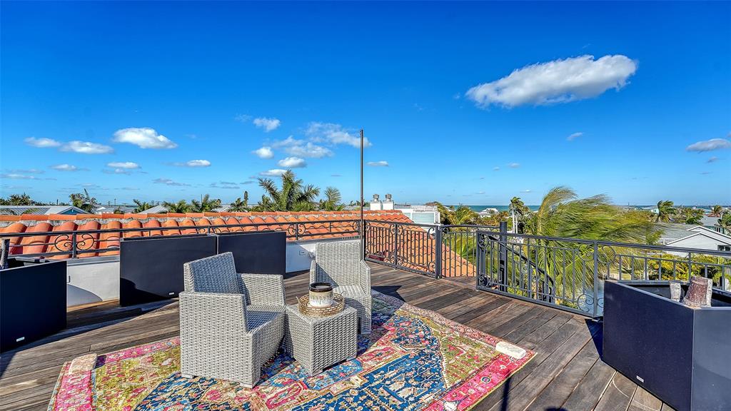 513 Villa Rosa Way Anna Maria, FL 34216 - Photo 35 of 57 a view of a terrace with furniture