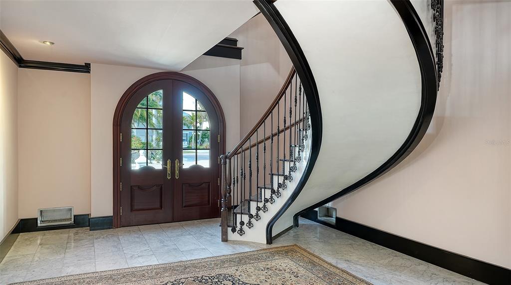 513 Villa Rosa Way Anna Maria, FL 34216 - Photo 40 of 57 a view of an entryway with wooden floor