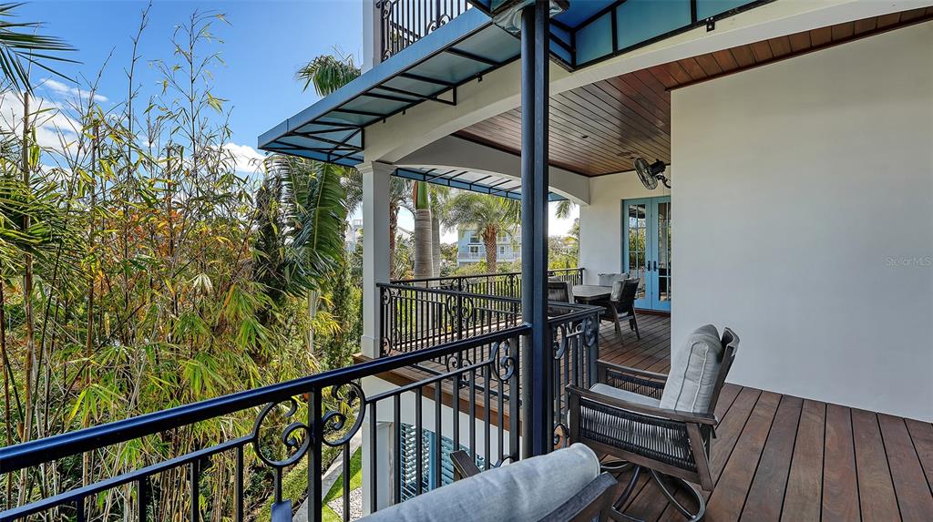 513 Villa Rosa Way Anna Maria, FL 34216 - Photo 42 of 57 a view of a two chairs in the balcony