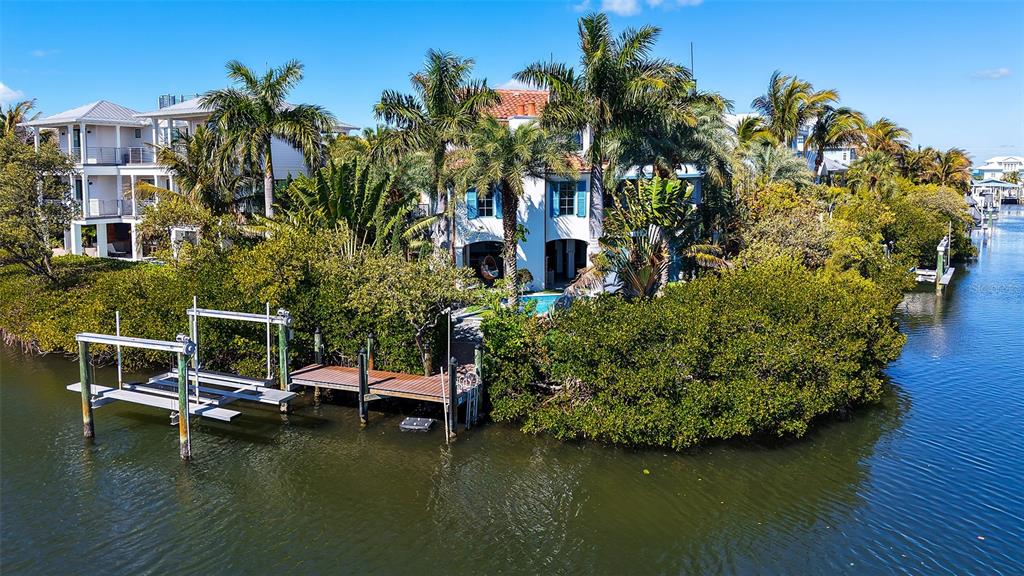 513 Villa Rosa Way Anna Maria, FL 34216 - Photo 43 of 57 a view of house with swimming pool and lake view