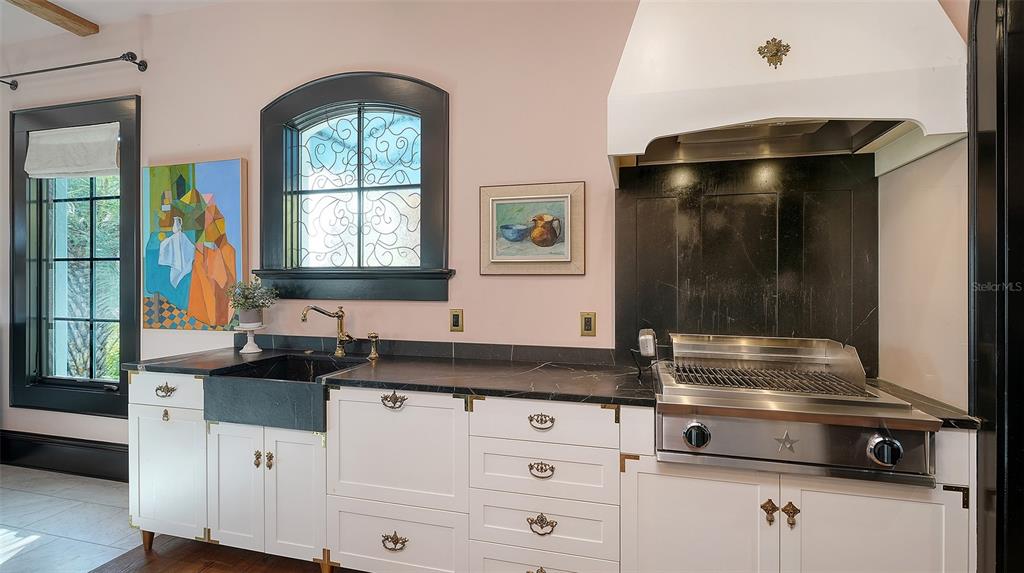 513 Villa Rosa Way Anna Maria, FL 34216 - Photo 49 of 57 a kitchen with a sink and a window
