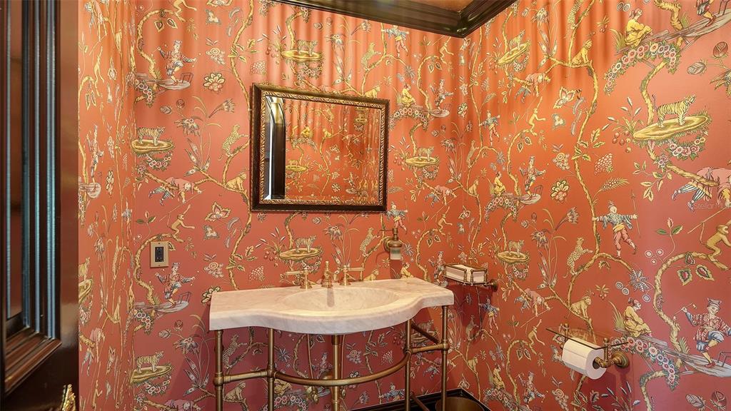 513 Villa Rosa Way Anna Maria, FL 34216 - Photo 51 of 57 a bathroom with a sink and a mirror