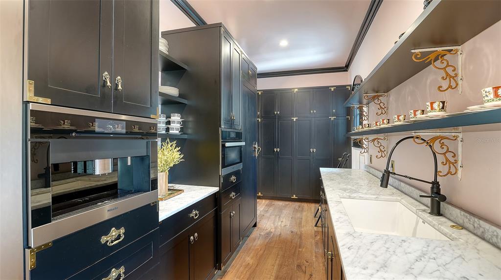 513 Villa Rosa Way Anna Maria, FL 34216 - Photo 9 of 57 a spacious bathroom with a granite countertop double vanity sink a mirror and a shower