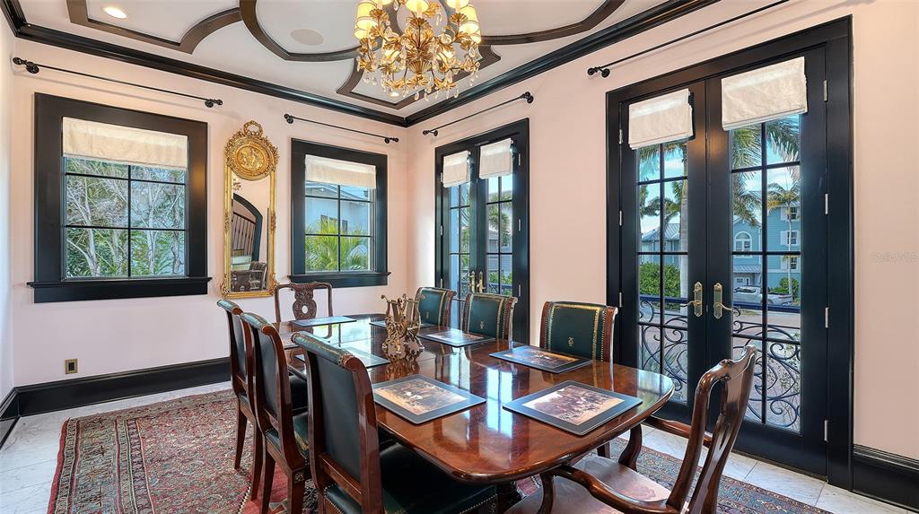 513 Villa Rosa Way Anna Maria, FL 34216 - Photo 10 of 57 a view of a dining room with furniture window and outside view