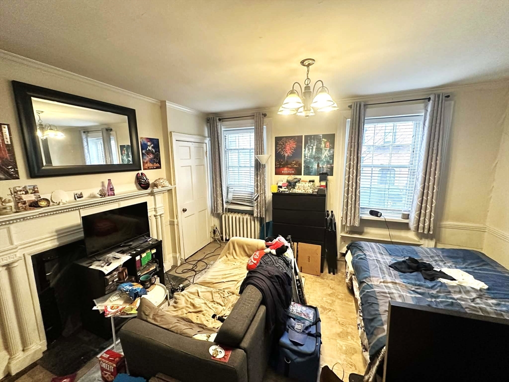 a living room with furniture fireplace and flat screen tv