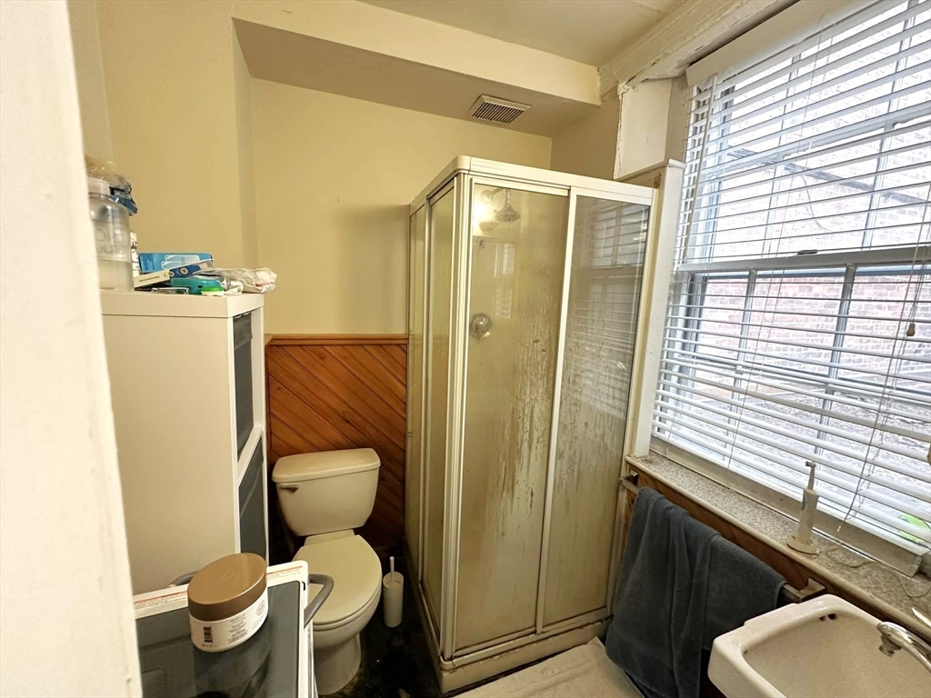 83 Charles Street, Unit 1 Boston, MA 02114 - Photo 9 of 11 a bathroom with a toilet and a shower