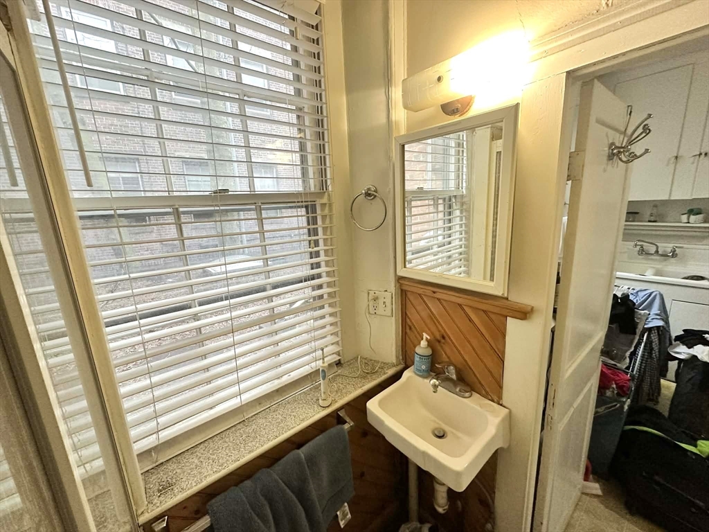 83 Charles Street, Unit 1 Boston, MA 02114 - Photo 10 of 11 a bathroom with a sink a toilet and a shower