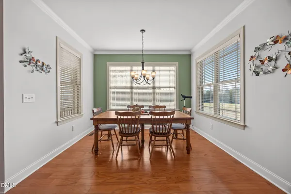 a view of a dining room with furniture window and outside view