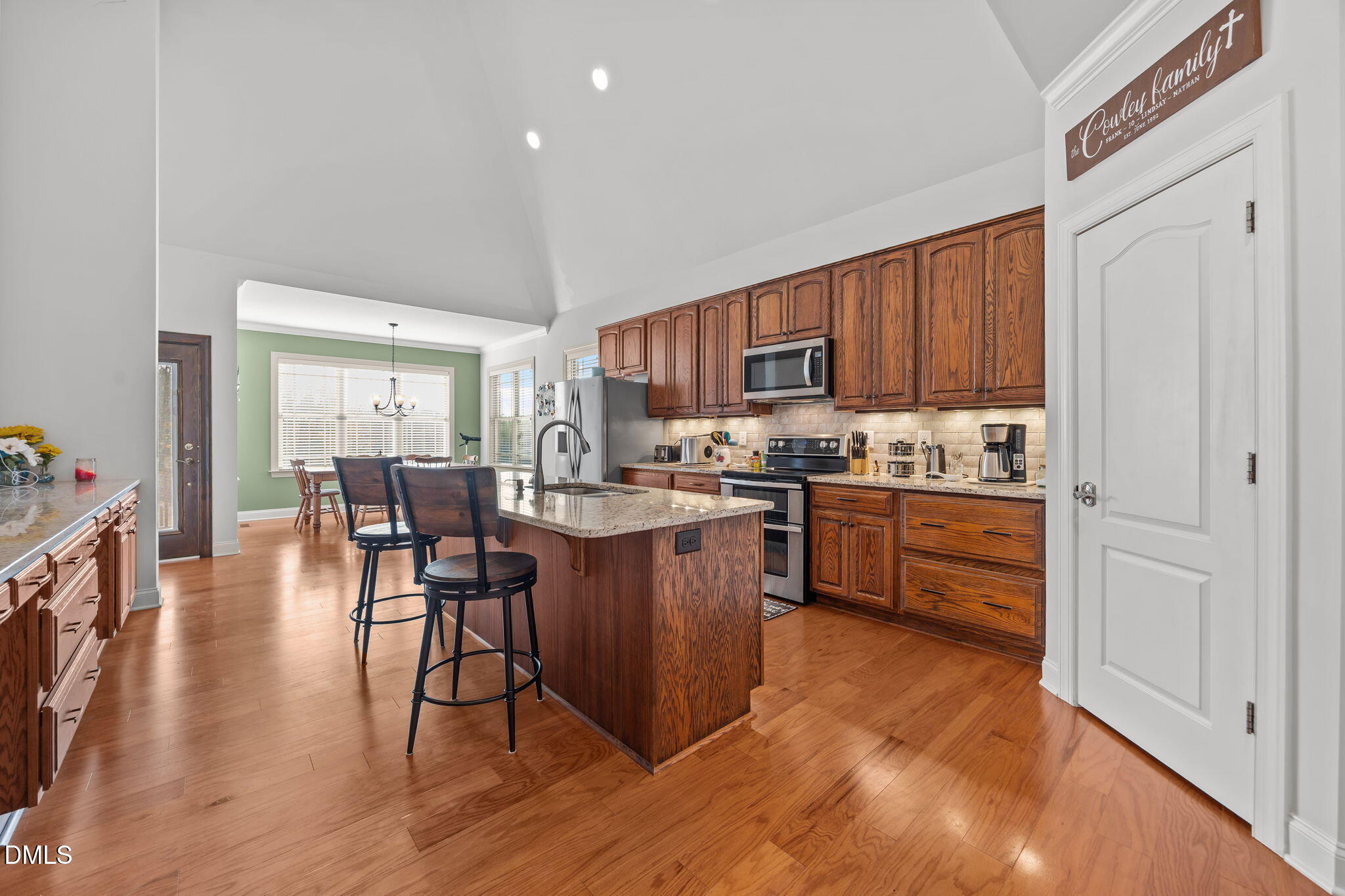868 Julie McKnight Road Kittrell, NC 27544 - Photo 14 of 54 a kitchen with a table chairs refrigerator and cabinets