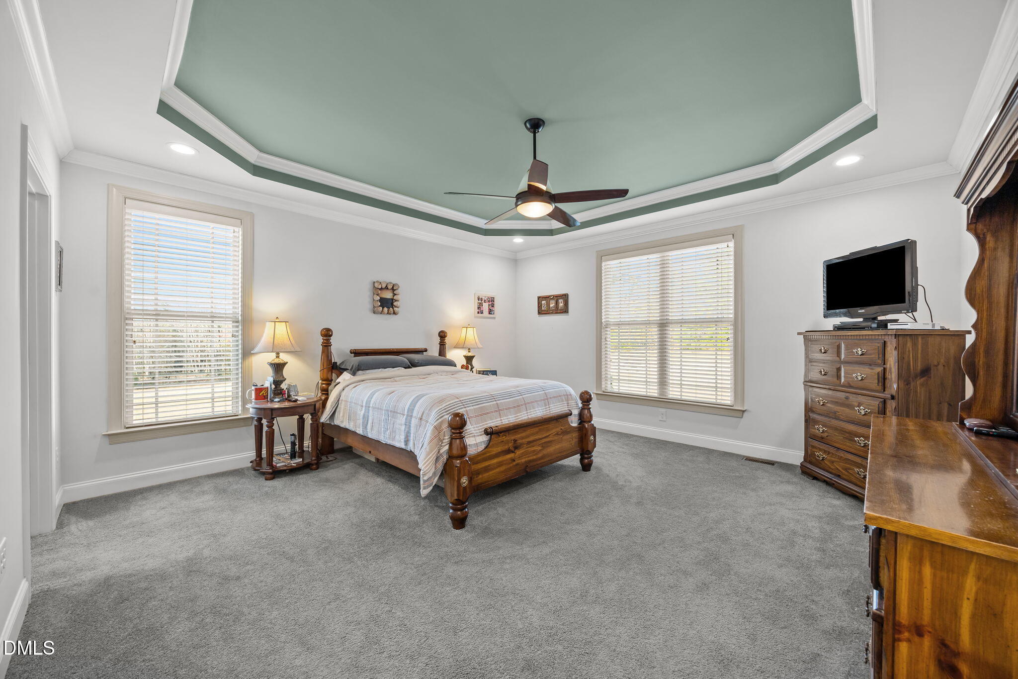 868 Julie McKnight Road Kittrell, NC 27544 - Photo 19 of 54 a bedroom with a bed and a flat screen tv