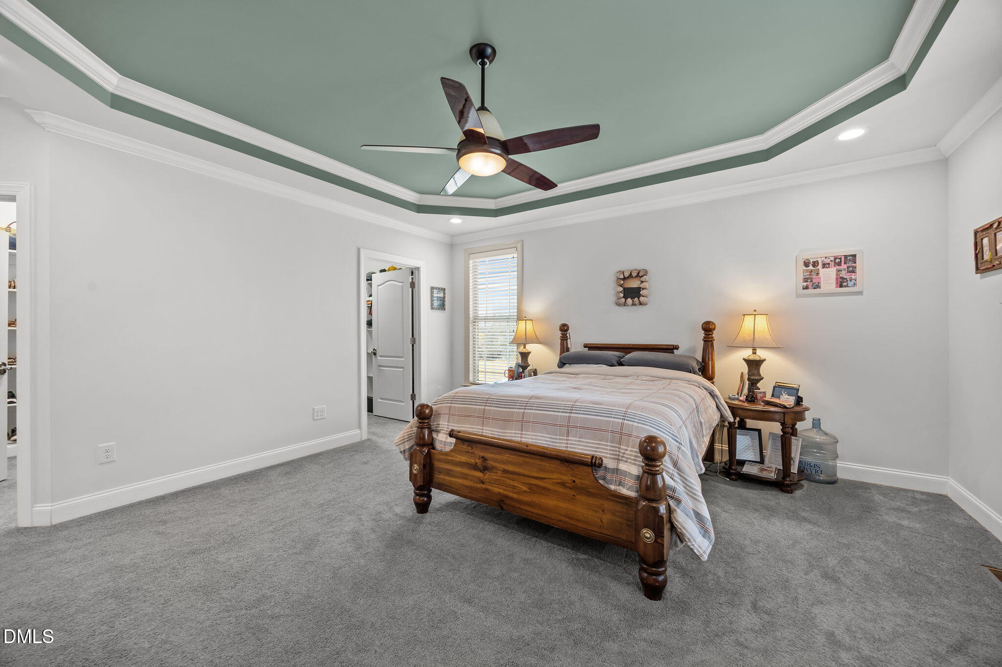 868 Julie McKnight Road Kittrell, NC 27544 - Photo 20 of 54 a bedroom with a bed and a chandelier