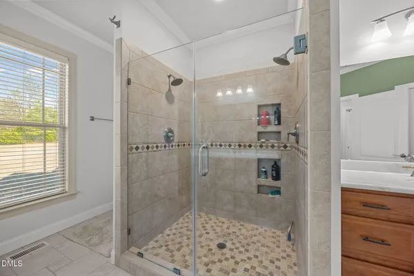 a bathroom with a shower and a sink
