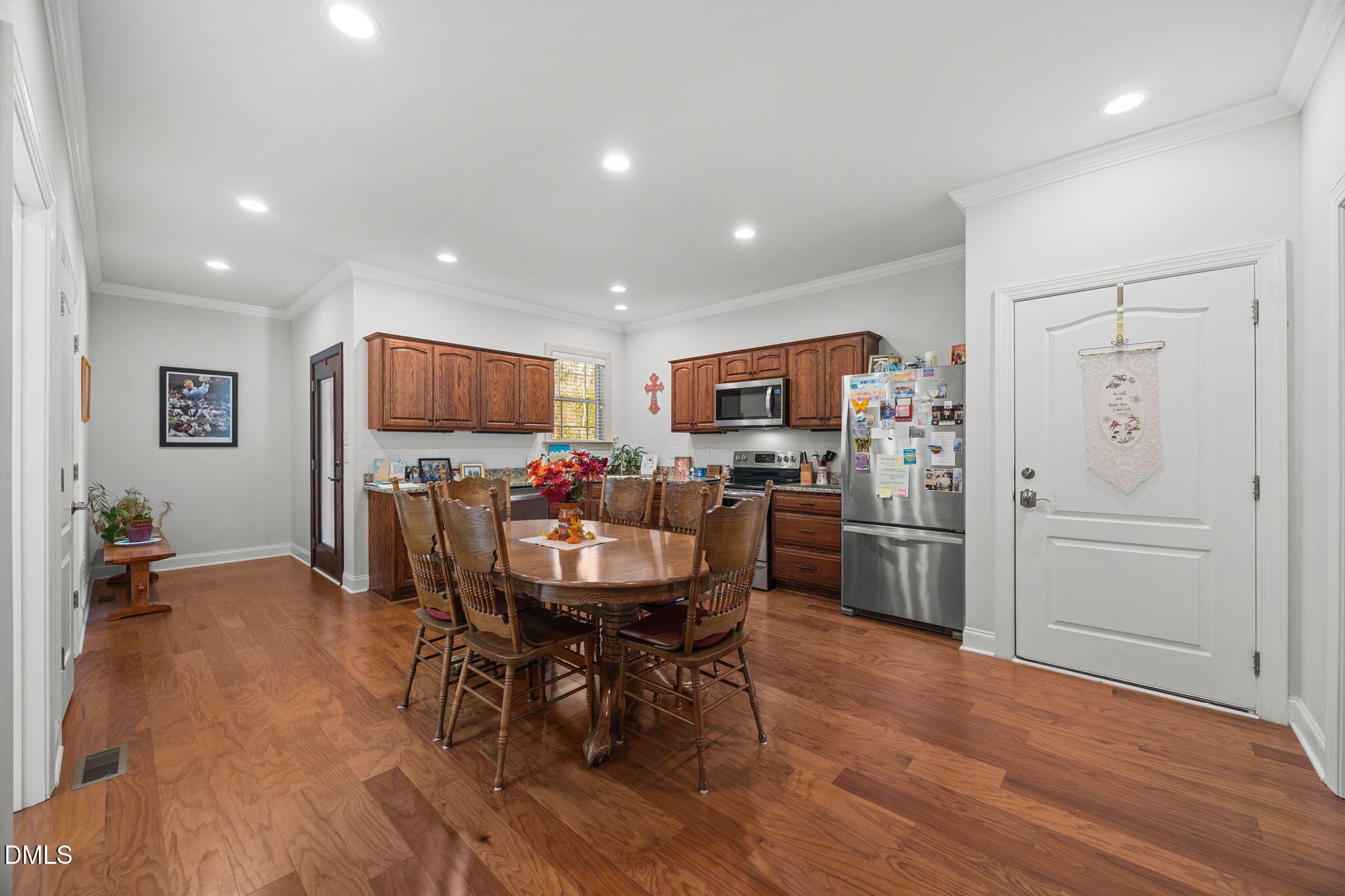 868 Julie McKnight Road Kittrell, NC 27544 - Photo 29 of 54 a view of a dining room with furniture and a refrigerator