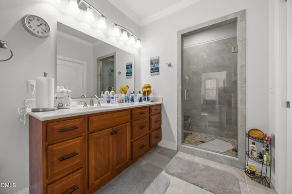 a bathroom with a sink a tub and a mirror