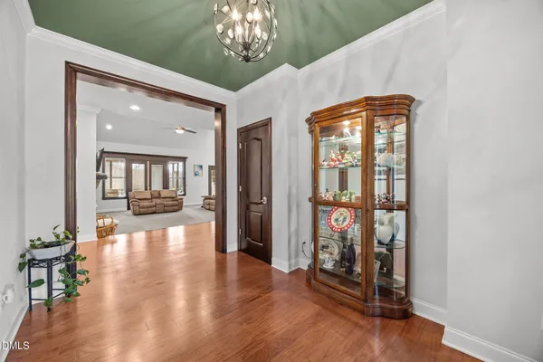 a view of an entryway with wooden floor
