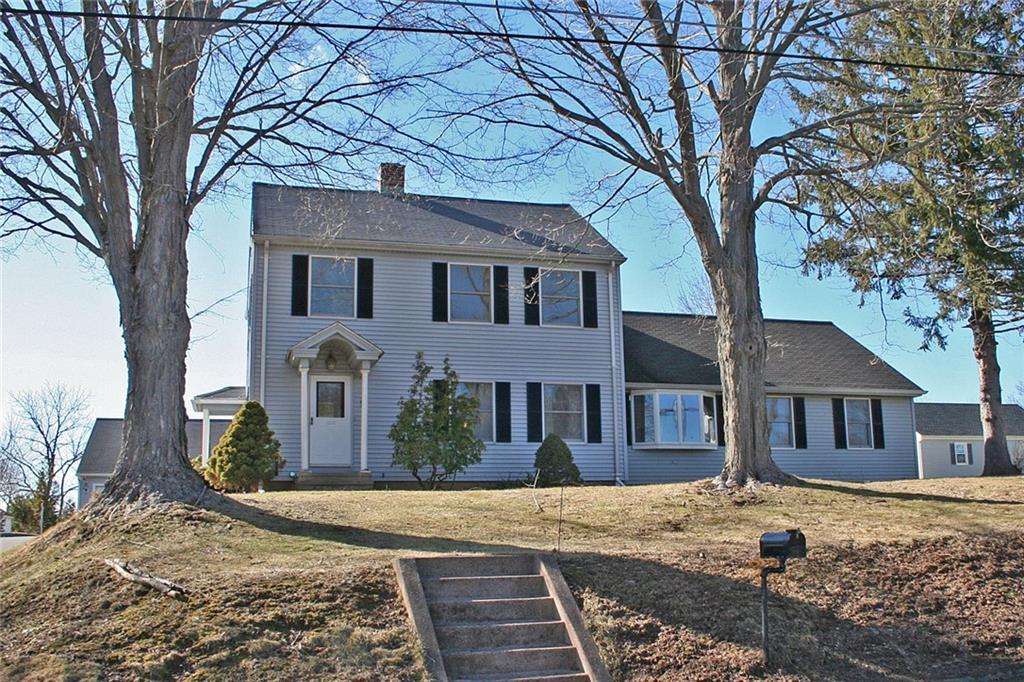 a front view of a house with a yard