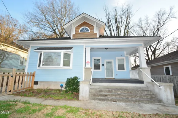a view of a white house with a large windows