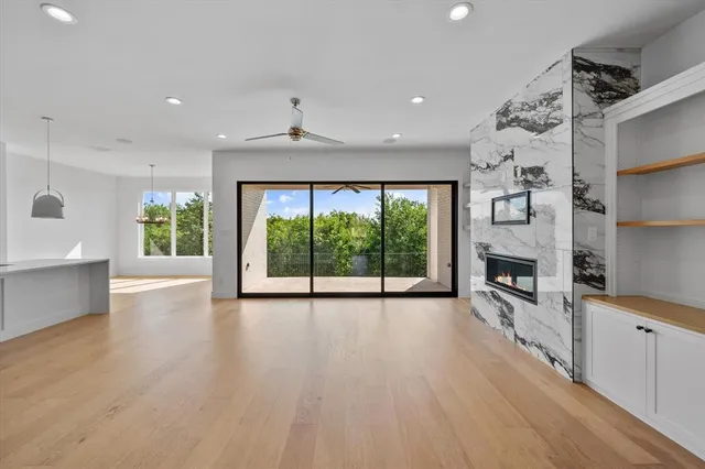 a view of a room with window and wooden floor