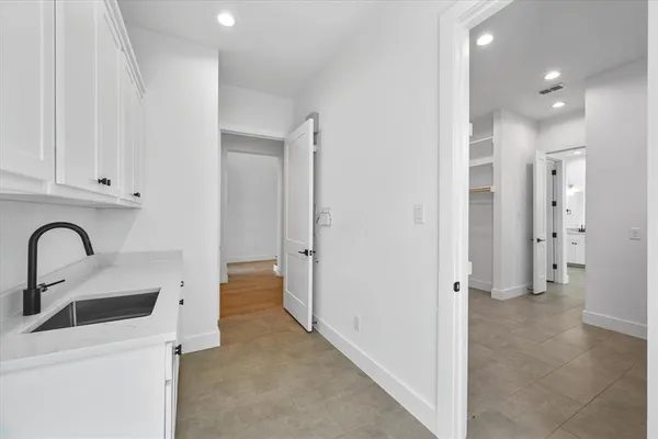 a white bath tub sitting next to a shower