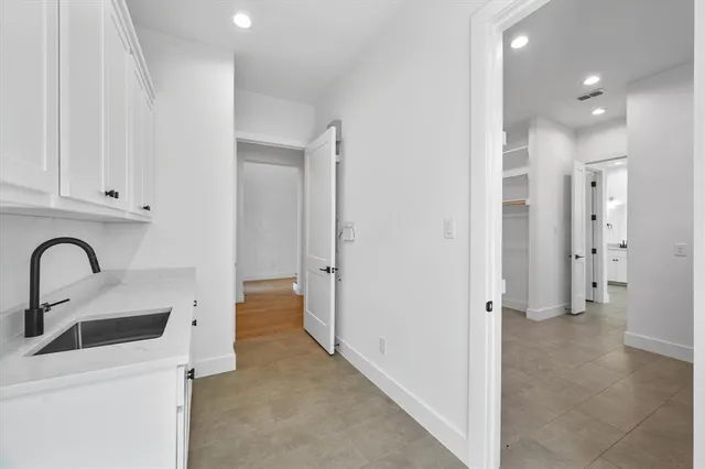 a white bath tub sitting next to a shower