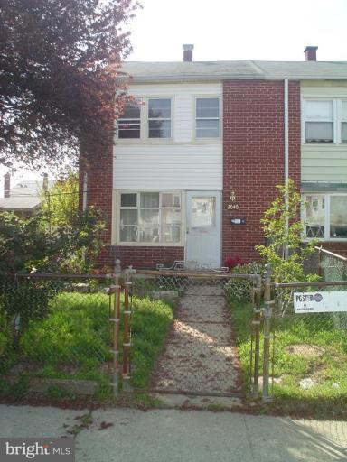 2040 Kelmore Road Dundalk, MD 21222 - Photo 1 of 1 front view of a house with a yard