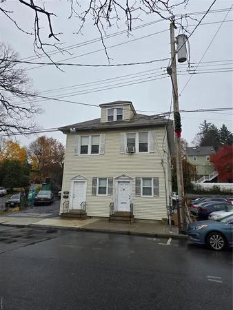 a view of a street with cars